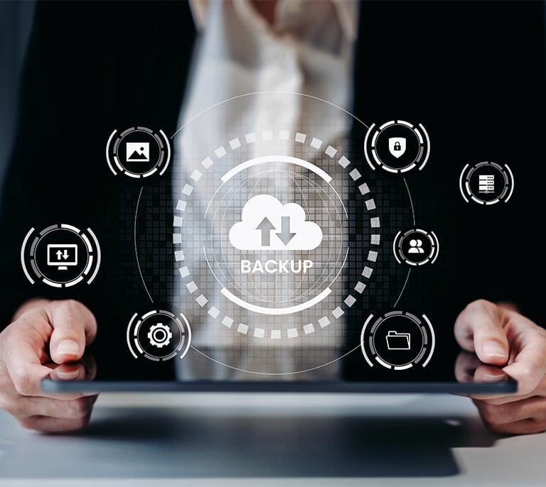 Business professional reviewing cloud backup management, data protection and recovery planning information on a digital interface.