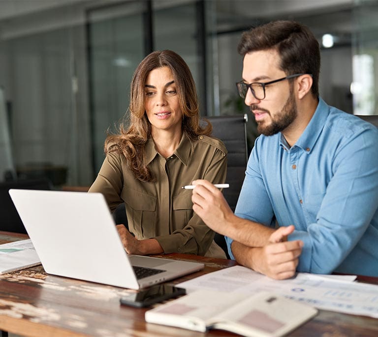 Business professionals collaborating on the development of a custom business application and workflow solution.