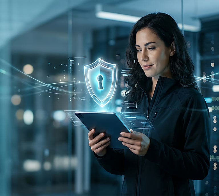 Cyber security professional reviewing digital security controls and resilience measures on a secure tablet platform.
