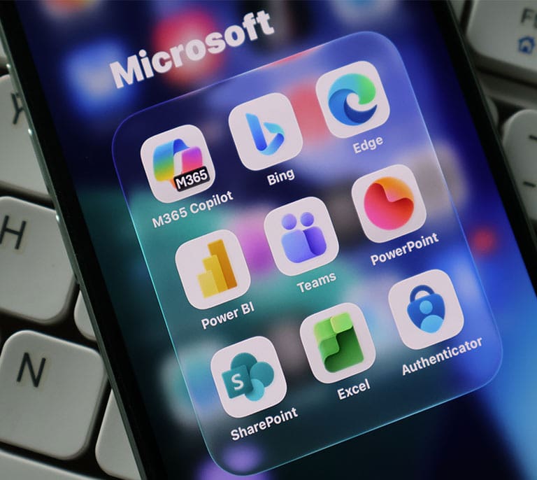 Microsoft applications displayed on a mobile device representing Microsoft Ads campaign migration, platform integration and digital advertising expansion.