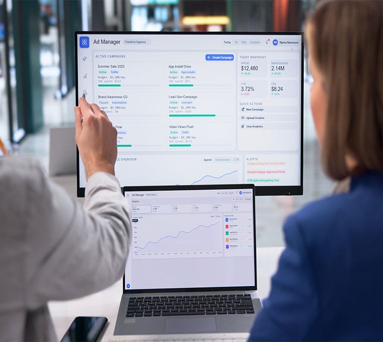 Digital marketers reviewing advertising dashboards, conversion data and campaign performance metrics for ongoing optimisation.