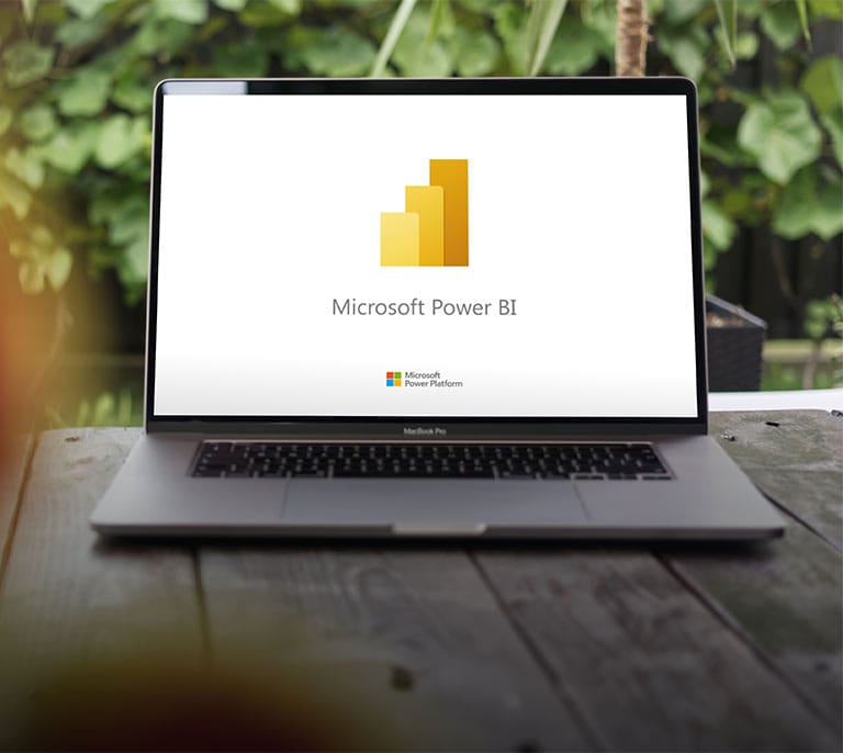 Microsoft Power BI platform displayed on a laptop representing business intelligence, reporting and data visualisation.