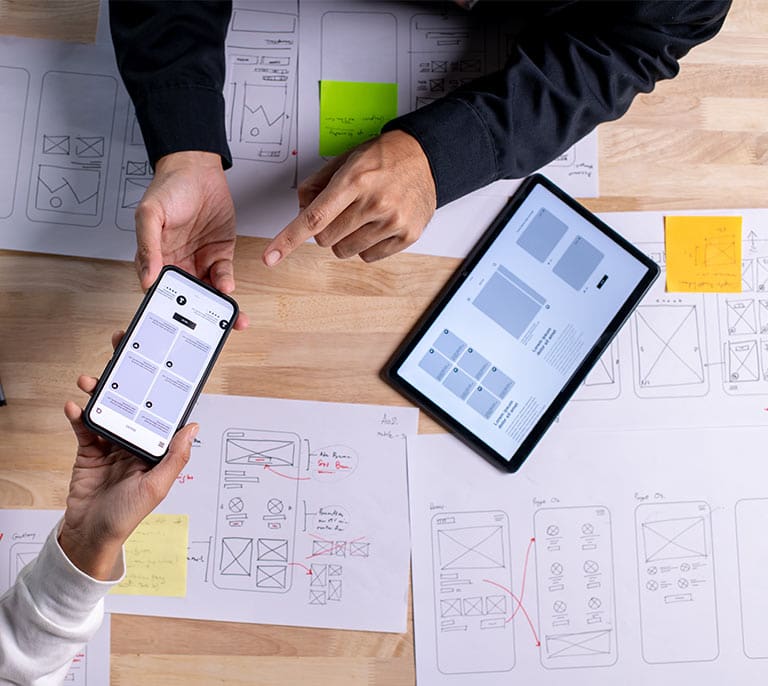 UX and responsive web design layouts being reviewed across multiple device screen formats.